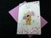 To Our Lovely Mum Boofle Holding Flowers And Gift Design Mother's Day Card